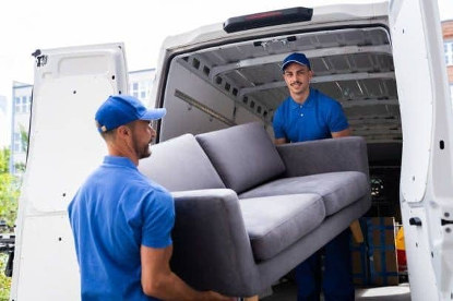 Two men carrying a double sofa set  